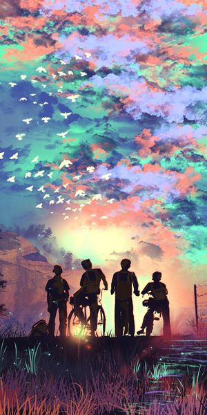 Vibrant Silhouettes of Friends with Bicycles in a Stunning Sky