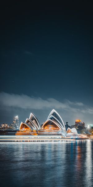 Nighttime Illumination of Sydney Opera House Reflecting in Water