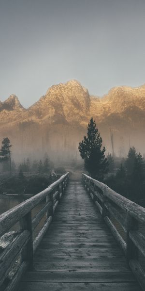 Foggy Mountain Landscape with a Wooden Bridge