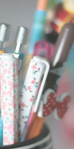 Vibrant iPhone Wallpaper Featuring a Colorful Array of Pens and Pencils