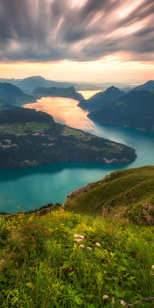 Majestic 4K Wallpaper of the Alps: River, Mountains, and Horizon