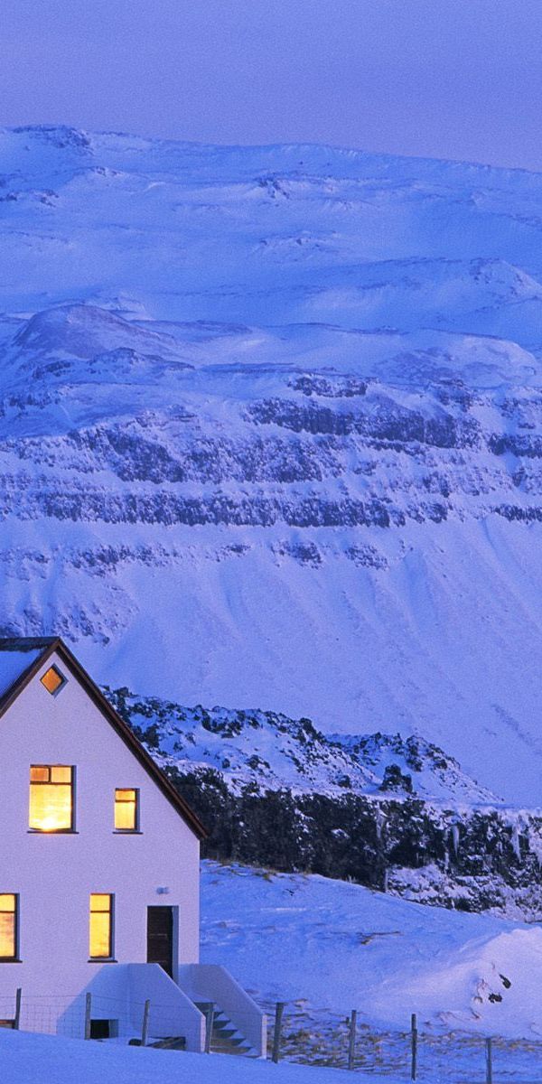 Breathtaking Winter Scene: White House in Snowy Mountains