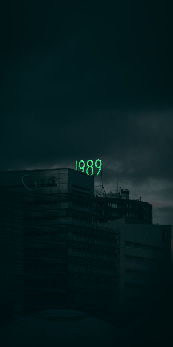 Dark Building with Illuminated 1989 Sign - Perfect Mobile Wallpaper