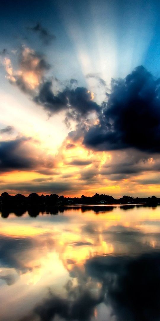 Breathtaking Sunset and Reflection Over a Serene Lake