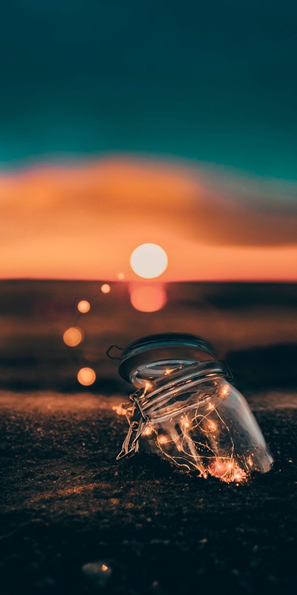 Glowing Jar at Sunset on the Shore
