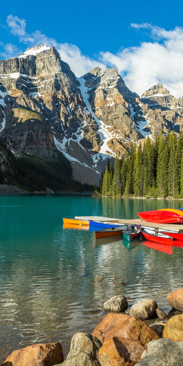 Breathtaking Mountain Lake with Colorful Boats