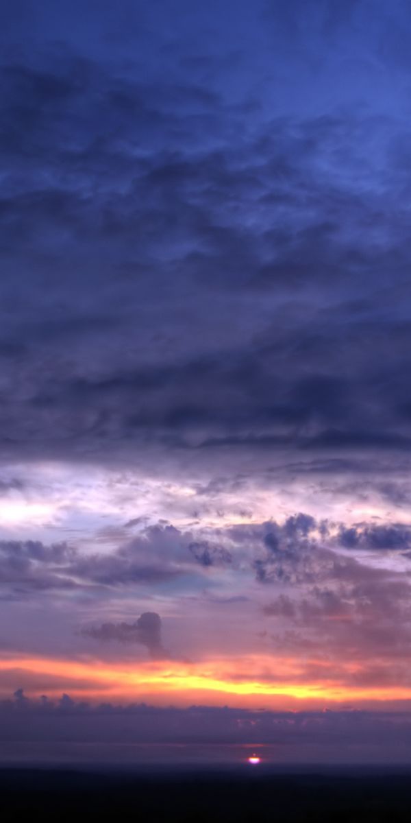 Beautiful phone wallpaper featuring a vibrant sunset over the earth and sky