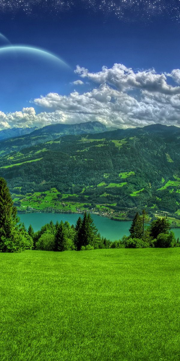 Breathtaking Hot Air Balloon Over Scenic Landscape Wallpaper