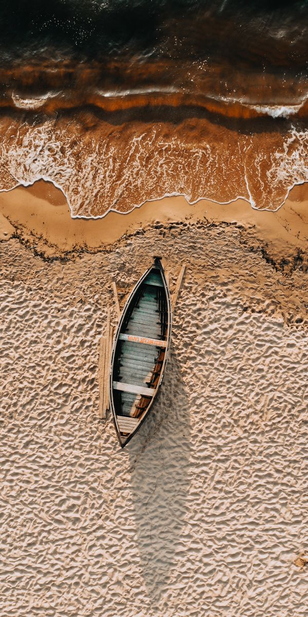 Aerial View of a Beach with a Boat