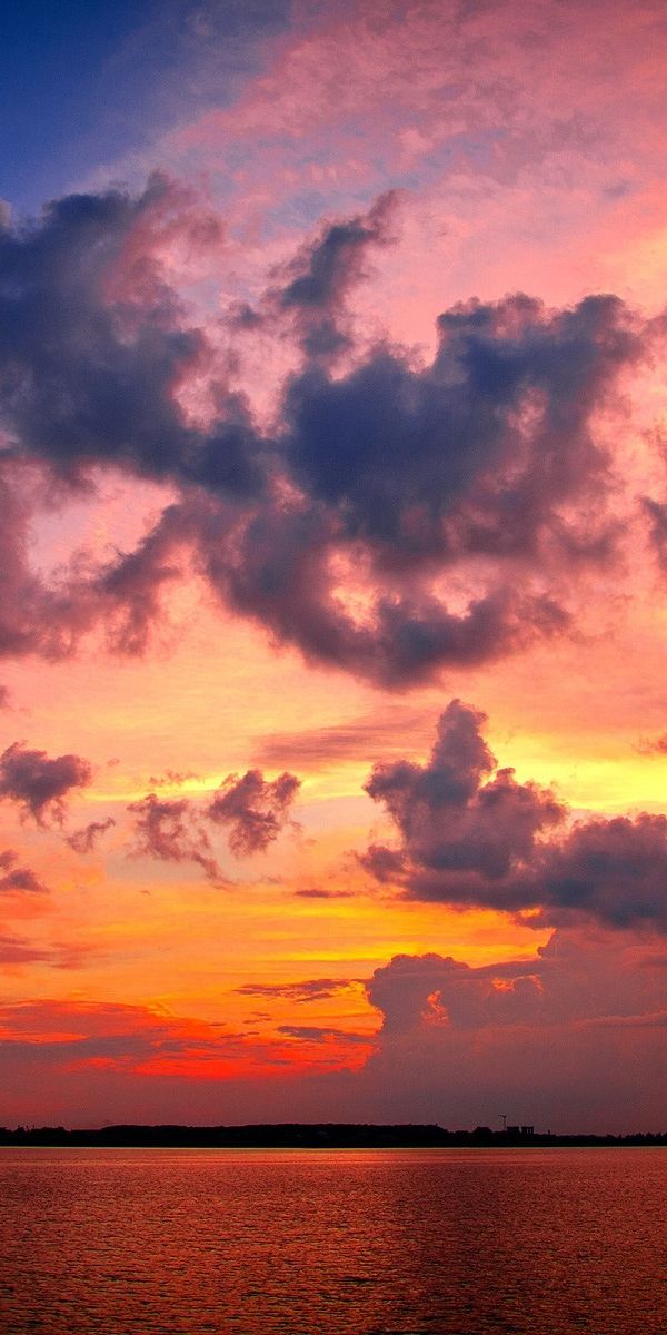 Breathtaking 4K phone wallpaper of Earth at sunset with vibrant colors