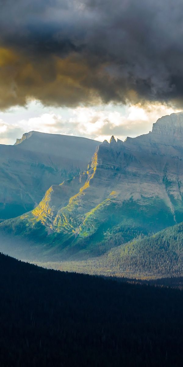 Majestic Mountain Range Under Dramatic Clouds