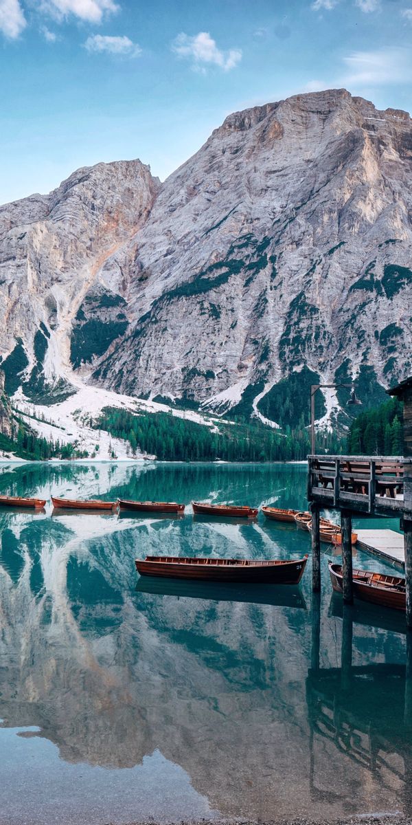 Tranquil Lake and Mountain Lodge - A Scenic Phone Wallpaper