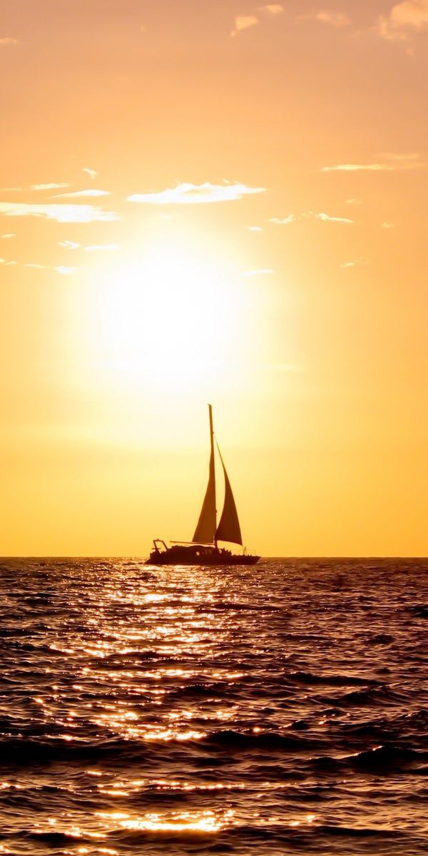 Serene sunset yacht wallpaper for your phone - perfect for ocean lovers