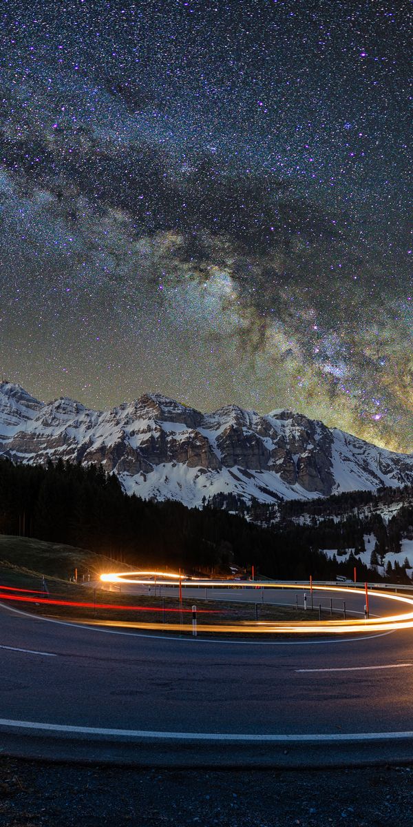 Breathtaking Mountain Road with Starry Sky Wallpaper