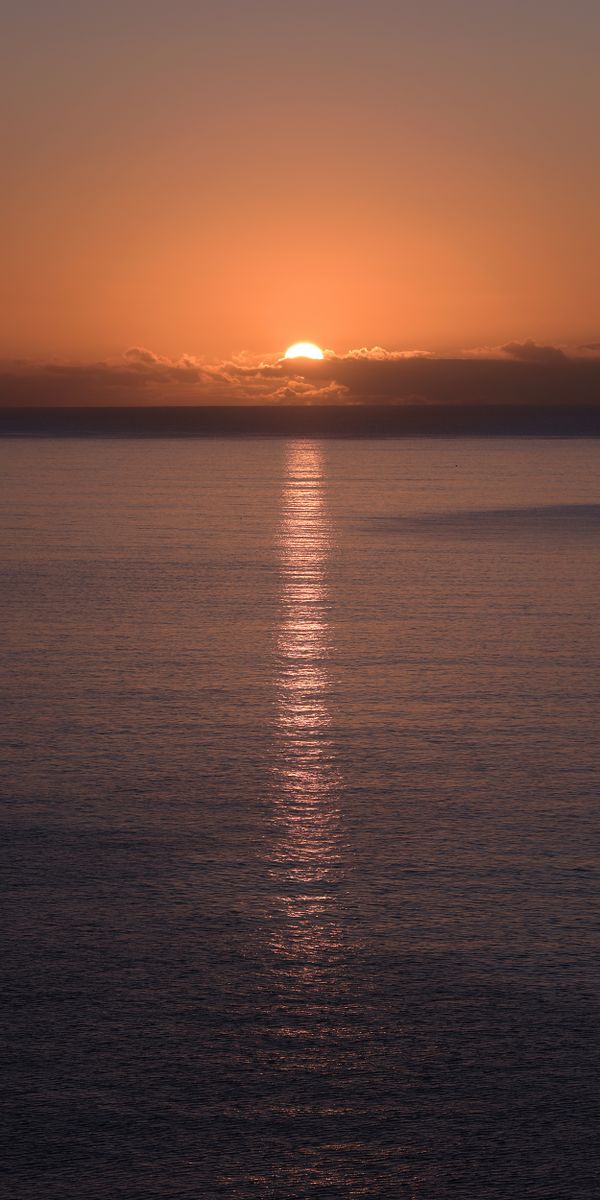 Breathtaking Sunset Over Water - Perfect Phone Wallpaper