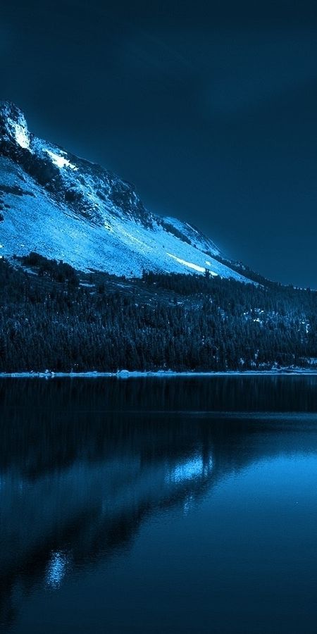 Enchanting winter lake scene with moon and forest - Free Phone Background