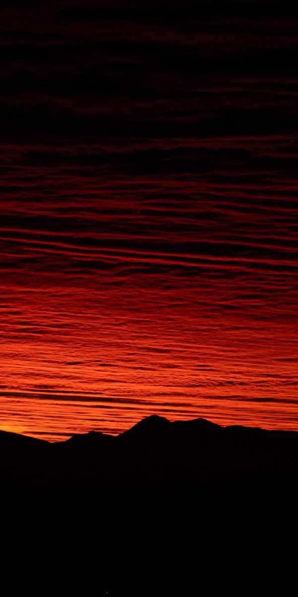 Breathtaking Sunset with Mountain Silhouettes
