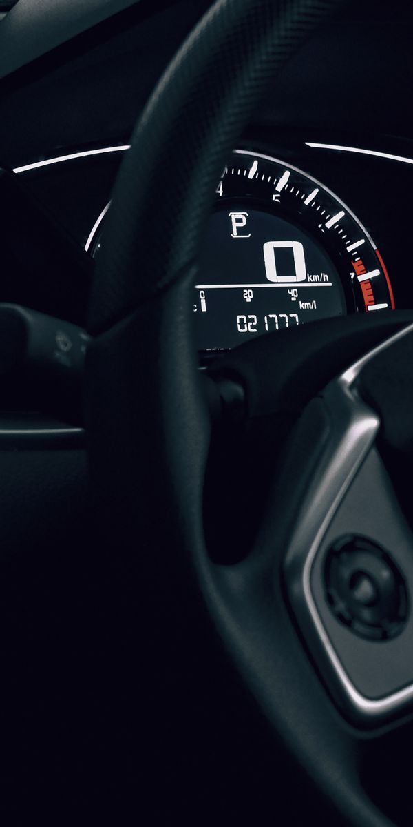 Sleek Dark Car Interior with Speedometer