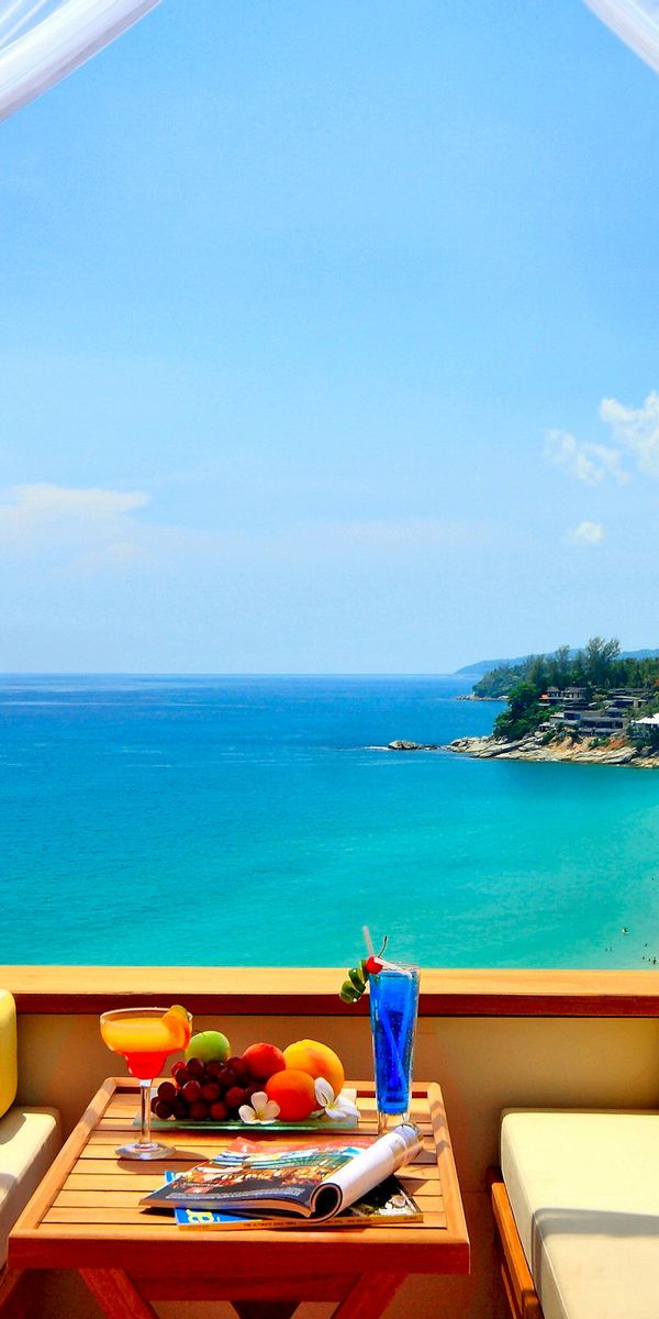 Breathtaking Turquoise Sea and Sky View Phone Wallpaper