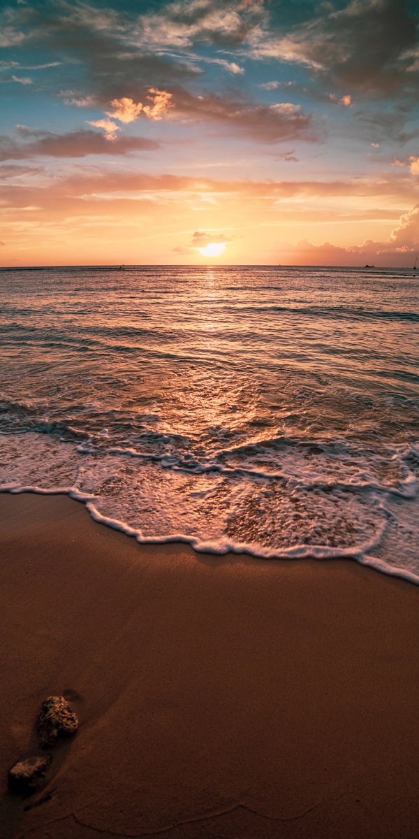 Serene Sunset Over the Beach with Gentle Waves