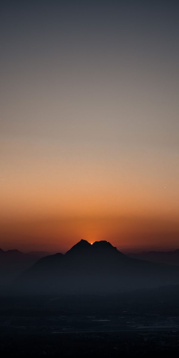 Breathtaking Sunset with Foggy Mountains at Dusk