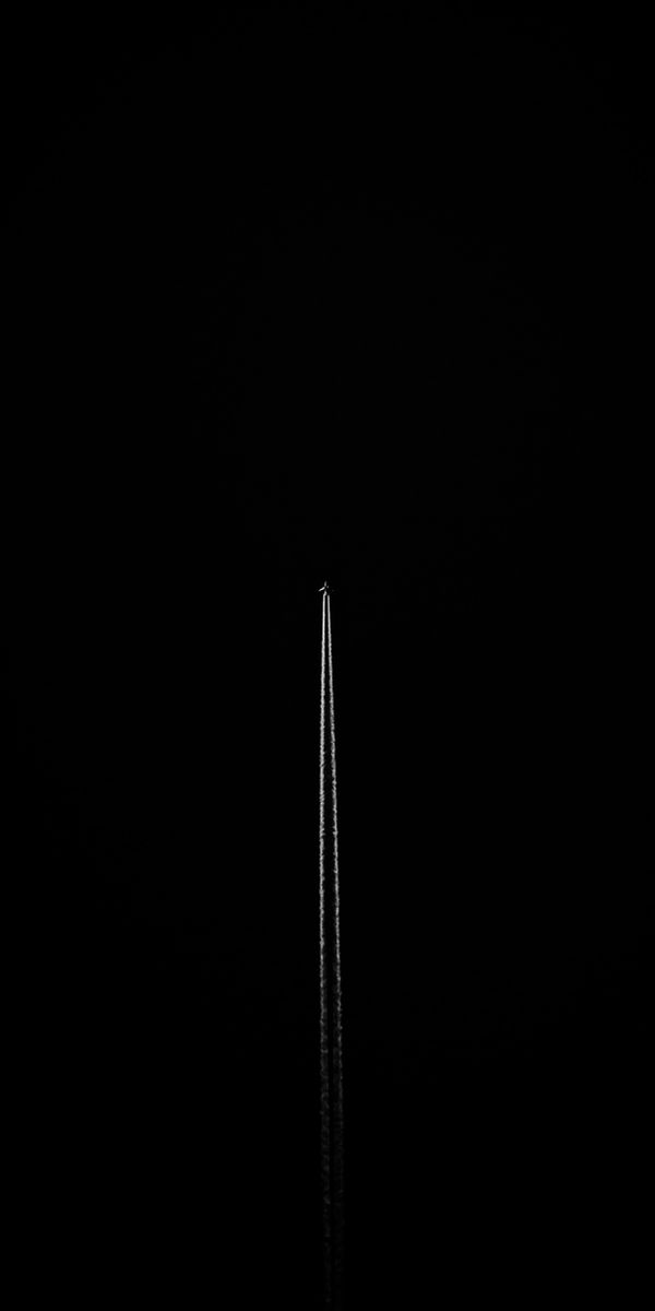 Elegant Dark Airplane in Flight Wallpaper