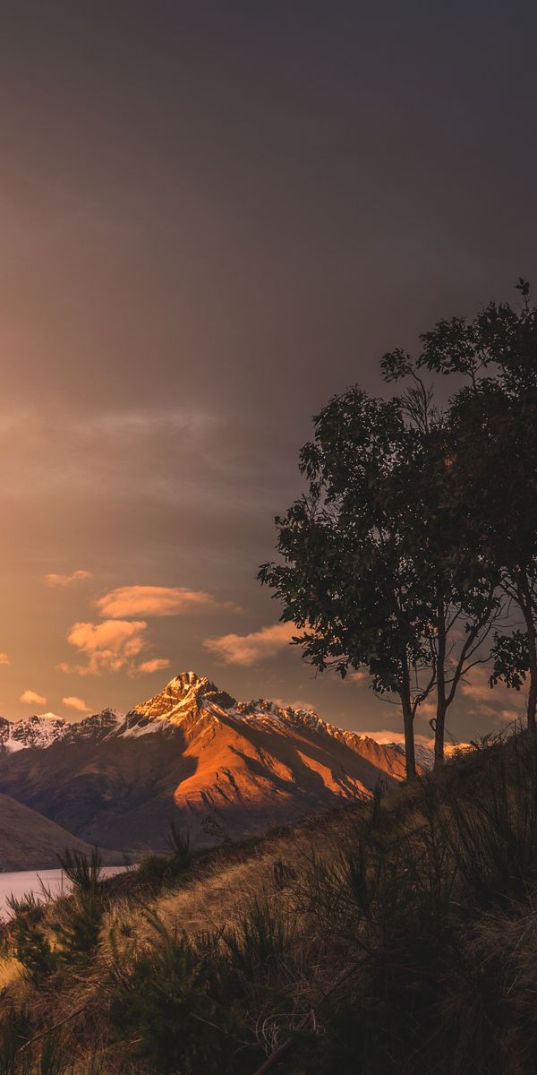 Breathtaking New Zealand Sunset Over Majestic Mountains and Lake