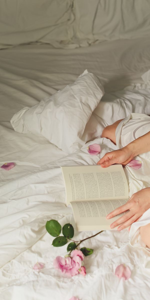 Phone wallpaper: Miscellanea, Bed, Miscellaneous, Petals, Flowers, Hands, Book free download