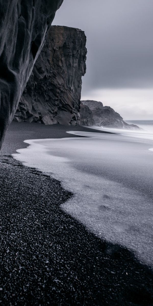 Dark Beach with Rocks and Ocean Waves for Your Phone Wallpaper