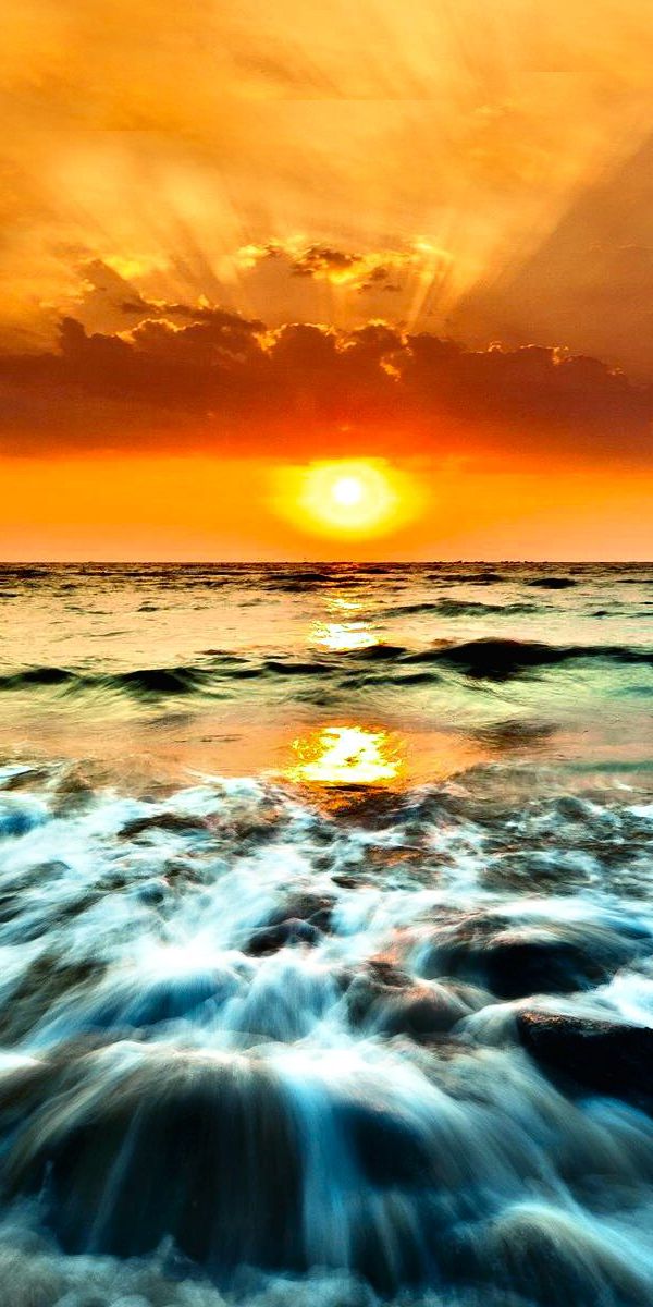 Breathtaking Ultra HD phone wallpaper featuring a vibrant ocean sunset