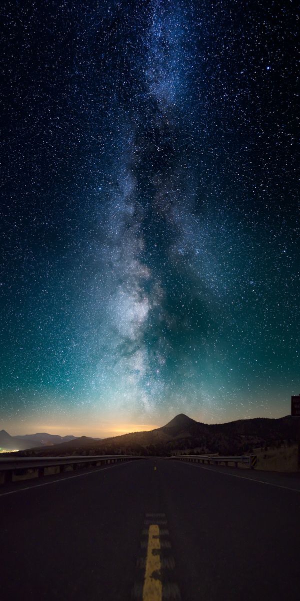 Breathtaking Starry Sky Above a Serene Road