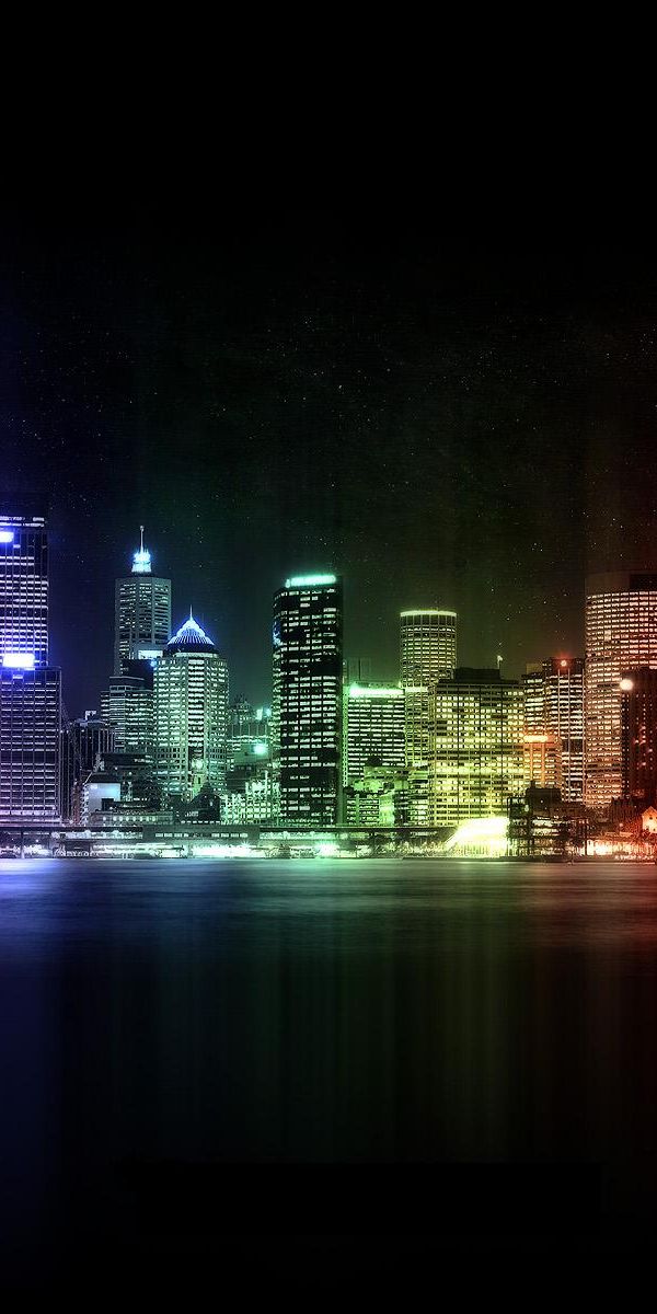 Vibrant Night Cityscape with Colorful Lights and Reflections