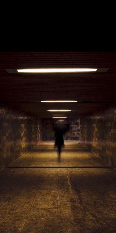 Creepy Ghost Strolling Through a Dark Tunnel