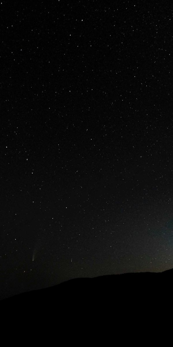 Starry Night Sky Over a Dark Hill