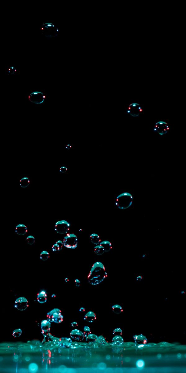 Macro Water Drops Splashing in Dark Background