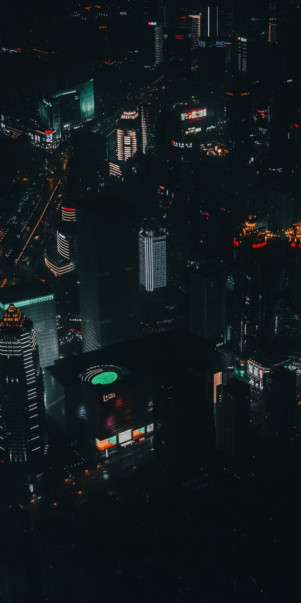 Breathtaking Night View of Skyscrapers Illuminated by City Lights