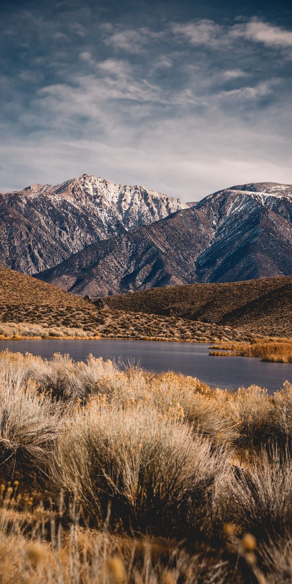 Awesome Mountain Landscape with Tranquil Lake and Lush Valley