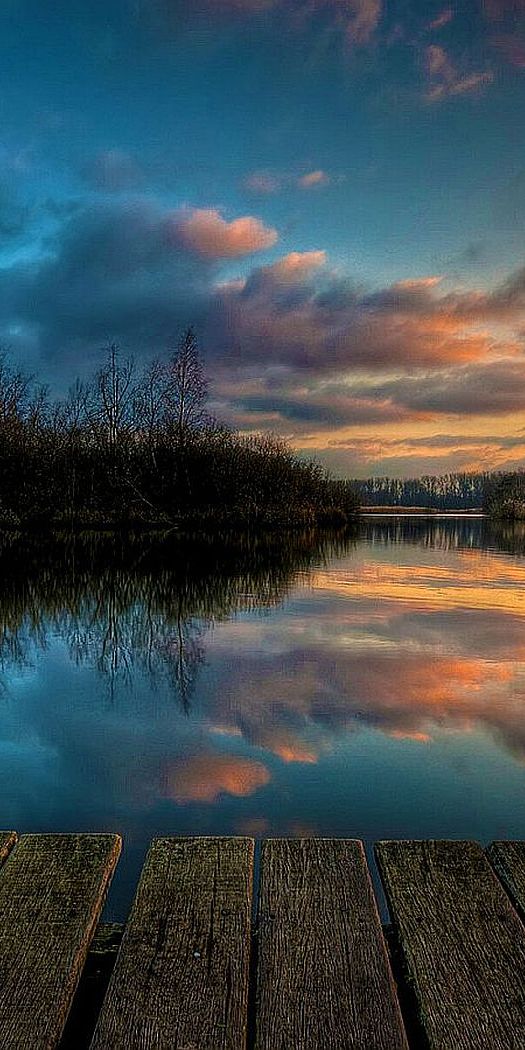 Breathtaking HD phone wallpaper of a sunset reflecting on a calm lake