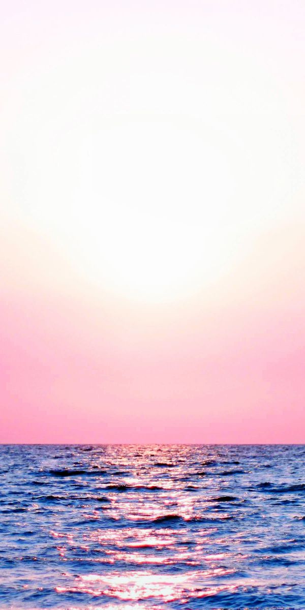 Beautiful pastel sunset wallpaper for iPhone featuring colorful sea and sky