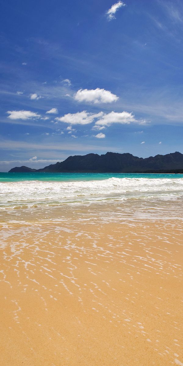Breathtaking 4K iPhone Wallpaper: Tranquil Beach with Waves and Clouds