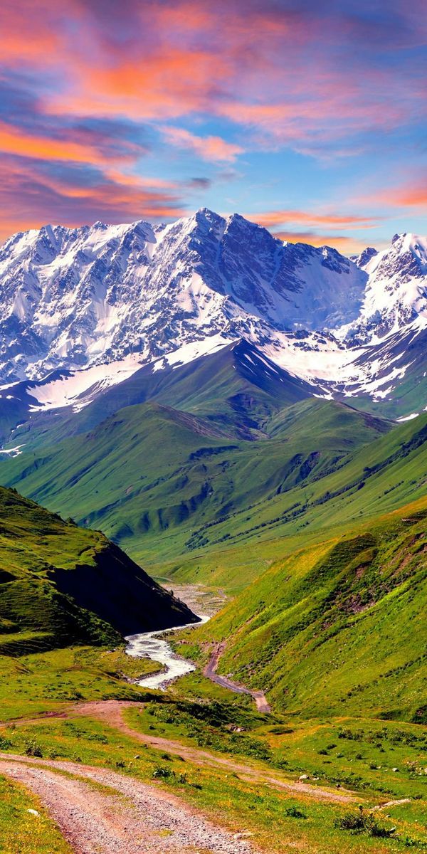 Breathtaking Sunset Over Mountain Valley with River Path