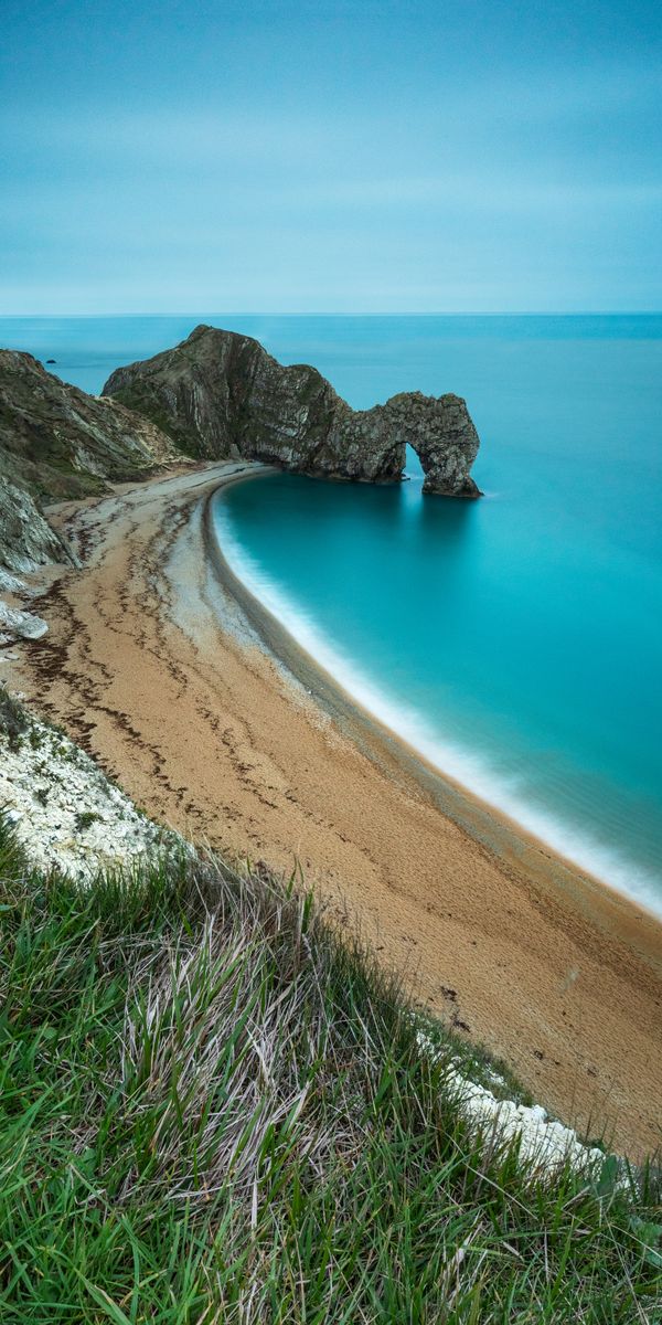 Epic Coastal View Featuring a Sandy Beach and Rocky Formation
