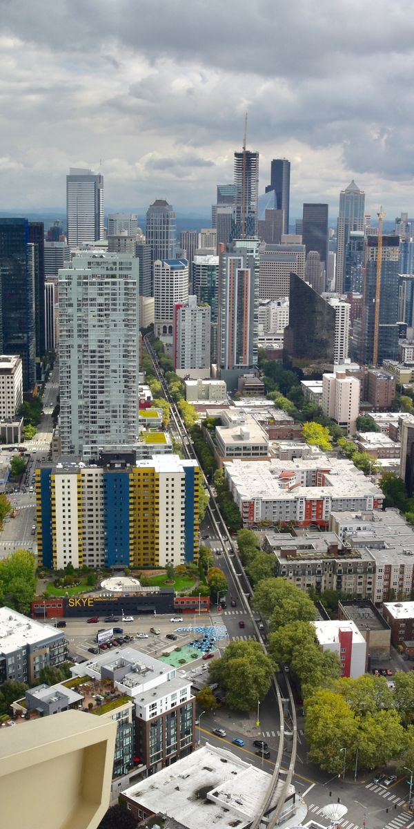 Epic Cityscape with Skyscrapers and Lush Greenery