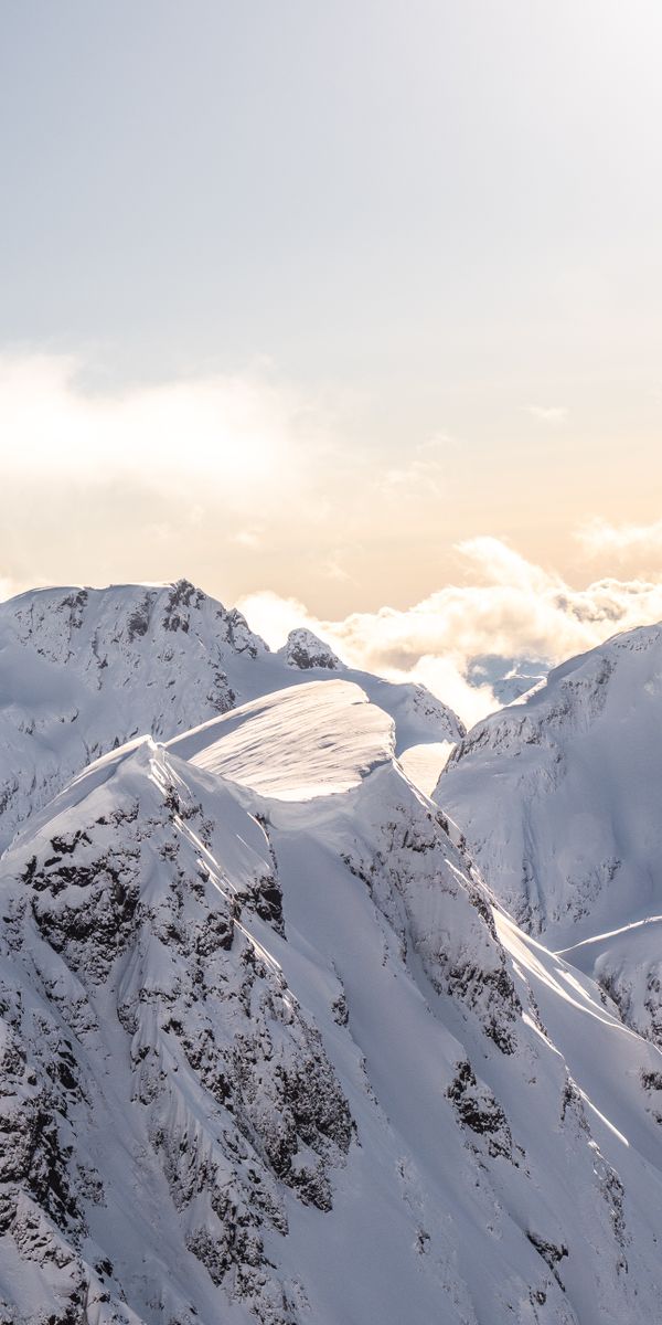 Breathtaking Snowbound Mountain Range Wallpaper