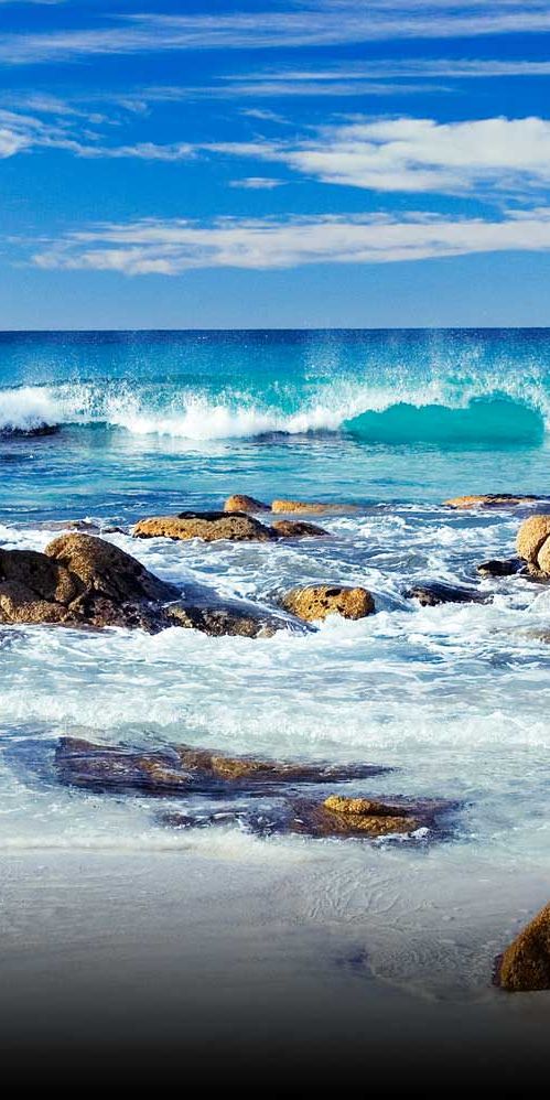 Beautiful Beach Scene with Vibrant Waves and Rocks