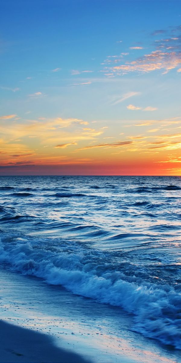 Breathtaking Ocean Sunset Over Waves