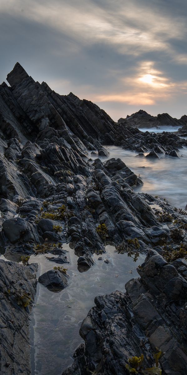 Breathtaking Sunset Over Rocky Coastline