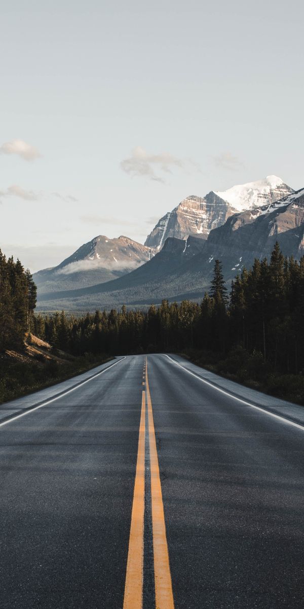 Breathtaking Road Through Mountain Landscape Wallpaper